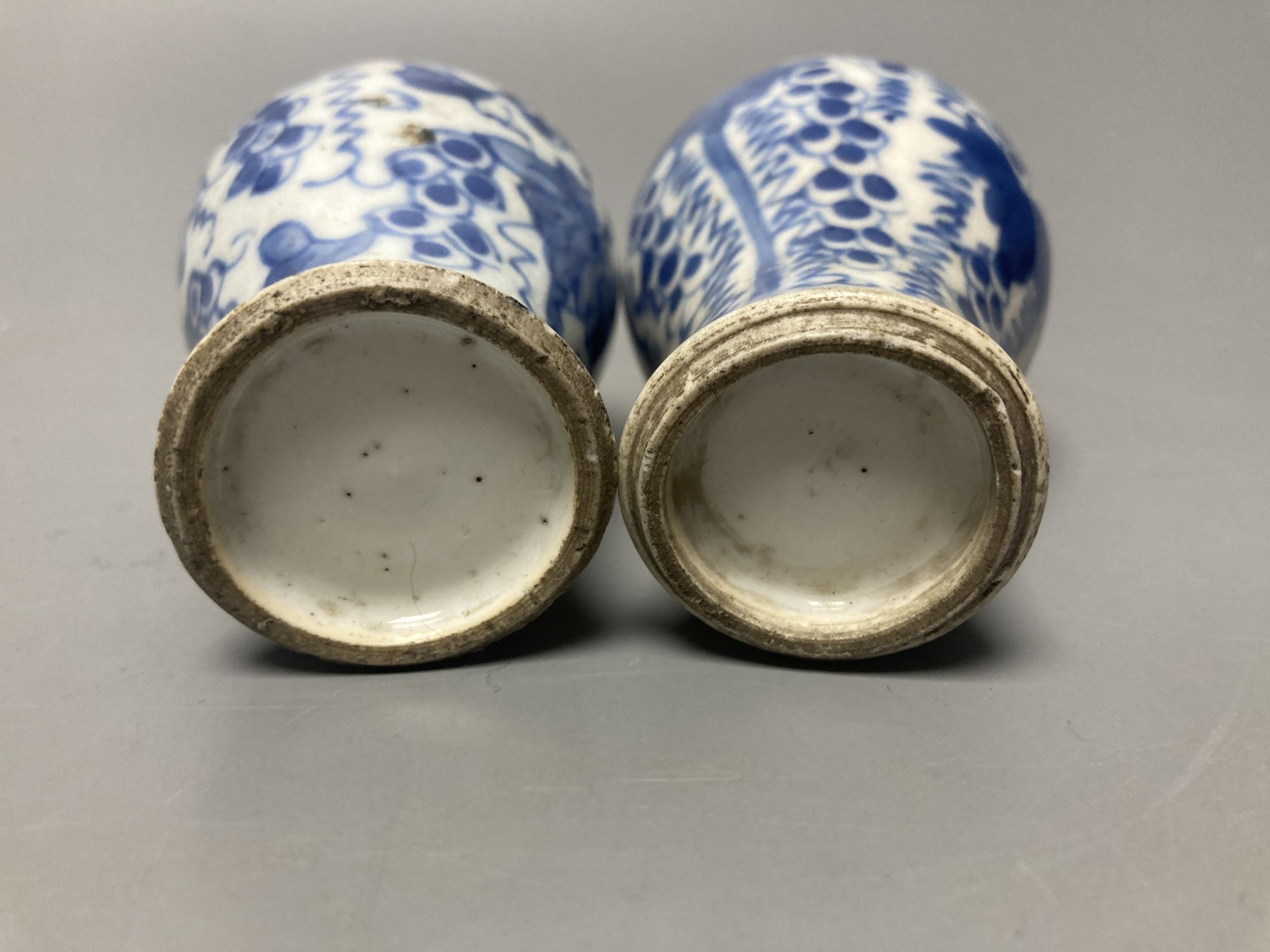 A pair of Chinese Kangxi blue and white small vases, height 12cm